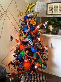 a decorated christmas tree with balloons and streamers