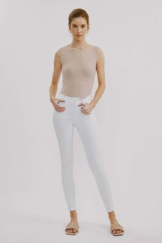 This White Skinny Jean is a closet must-have. It features a zipper front, as well as front and rear pockets for convenience. Constructed with comfort stretch denim, it offers a snug fit with just the right amount of give. The high rise waist helps to enhance the silhouette while the non-distressed finish provides a tim Sweater Blouse, The High, Skirt Pants, Bottoms Pants, Short Sets, Stretch Denim, Snug Fit, White Jeans, Sweater Top