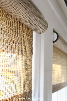 the blinds are made out of wicker and hanging on the side of a wall