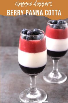 two glasses filled with blueberries and cream on top of a table next to each other