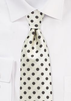 The Ivory and Brown Polka Dot Necktie is a versatile accessory that complements a variety of suits for men's weddings, shopping for suits, or tuxedos. Its neutral color scheme allows it to pair well with both dark and light-colored suits, including black, navy, gray, and tan. The polka dot design adds a touch of personality and style to any outfit, making it perfect for both formal and semi-formal occasions. Whether you're attending a wedding, a business meeting, or a special event, this necktie White Dapper Ties For Black Tie Events, Dapper White Ties For Black Tie Events, Dapper White Tie For Black Tie Events, Dapper White Suit And Standard Tie Accessories, Elegant White Tie For Groom, White Ties For Black Tie Events, White Standard Tie For Formal Occasions, Classic White Ties For Groom, Classic White Tie For Groom