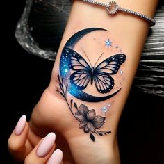 a woman's arm with a butterfly and flower tattoo on it