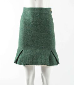 For Sale on 1stDibs - Vivienne Westwood Autumn-Winter 1991 green tweed mini skirt with white tulle crinoline at the front with broderie anglaise trim. Fitted Green Tweed Dress For Fall, Winter Fitted Tweed Skirt, Fitted Tweed Pencil Skirt, Fitted Green Mini Skirt For Winter, Fitted Green Mini Skirt For Fall, Green Tweed, The Vivienne, Tweed Mini Skirt, White Tulle