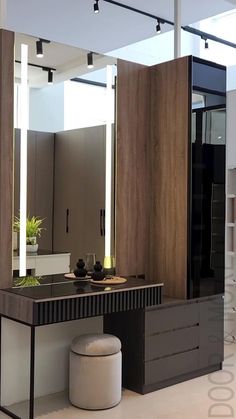 a bathroom with a vanity, mirror and stool in it's centerpieces