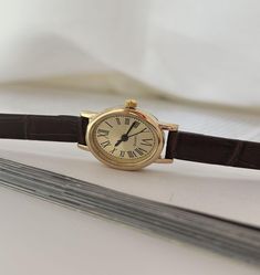 Gold Womens Wrist Watch, Vintage Gold Watch, Roman Numerals Minimal Watch, Small Retro Watch, Leather Strap Dainty Watch, Dainty Dial, Gift + Quartz Movement + Stainless Steel Case + Adjustable Leather Strap + Vintage Look + Oval Dainty Dial + Roman Numeric + Dainty Design + Minimal Look + Shipping From EU to World Wide Small Leather Watch, Vintage Watch For Women, Retro Watches Women, Small Watches Women Vintage, Vintage Watches Women Leather, Small Watches Women, Oval Watch, Dainty Watch, Minimal Watch