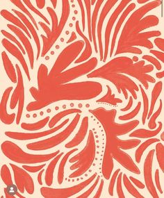 an orange and white wallpaper with red designs on it