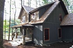 a house in the woods surrounded by trees