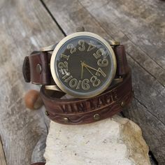 "Made from top quality vegetable tanned leather. Hand dyed (medium brown) and stamped with bronze retro watch face 1 x times around the wrist. Case Diameter: app 3.9cm Case Thickness: app 10mm The band adjustable 16-18 cm If you need a different size, please leave your Exact Wrist size for better adjust in \"Note from Buyer\" section of your order! Please visit to my another shop: https://www.etsy.com/shop/JeansBelt?ref=hdr_shop_menu FEDEX to USA, Canada and Australia! If you need a faster shipp Vintage Leather Strap Watch For Everyday Use, Vintage Watch With Leather Strap For Everyday Use, Vintage Adjustable Watch Accessories With Analog Display, Vintage Brown Leather Watches, Vintage Brown Watches With Leather Strap, Vintage Brown Watch With Leather Strap Accessories, Vintage Brown Watch With Leather Strap, Vintage Leather Watch Accessories In Distressed Brown, Vintage Distressed Brown Leather Watch Accessories