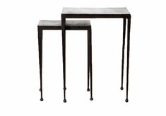 two tables with metal legs and marble top, one is made out of black iron