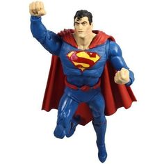 a superman action figure with his arms in the air