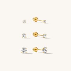 Sparkly and dainty, the Tiny CZ Screwback Stud Earrings are subtle yet stunning. They're so dainty and lightweight that you’ll forget they're even on. They have rounded screw backs so they're perfect for 24/7 wear without your head getting poked. Dress them up or down - either way, they'll instantly make you feel more confident and put together! Made of solid gold, they are ready for years of little dates and big adventures together. DETAILS 14k solid gold screwback studs Available in 2mm, 3mm, Ocean Inspired Jewelry, Dainty Initial Necklace, Circle Bracelet, Detailed Necklace, Opal Earrings Stud, Dangle Necklaces, Opal Studs, Bridesmaid Necklace, Stone Gold