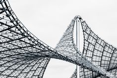 two large metal structures in front of a cloudy sky