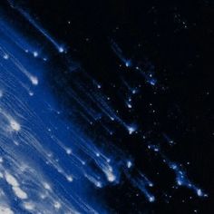 an image of the earth taken from space with stars in the sky and clouds all around it