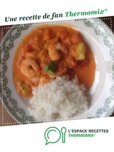 a plate with rice, shrimp and vegetables on it is featured in the cover of an article