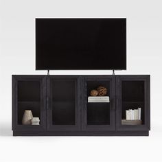 an entertainment center with bookshelves and a flat screen tv