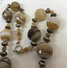 I am not sure of the origin of this agate, I think maybe Brazil or Australia. gorgeous stuff. never saw banding like this, or honeycomb face ting. Beautiful Beaded Necklaces, Jamais Vu, Ruby Pendant, Pretty Colors, Banded Agate, Key Pendant, Pearl Gemstone, Jewelry Business, Agate Beads