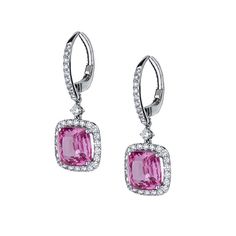 Amazing 18K white gold huggie earrings featuring drops of pink sapphire gemstones in diamond halos. Two sapphire gemstones measure to a total carat weight of 7.29 carats. The diamonds that align this gemstone measure to a total carat weight of 0.91 carats finely crafted in white gold. Luxury Pink Diamond Earrings With Accents, Pink Diamond Earrings With Accents, Gia Certified Pink Fine Jewelry Earrings, Pink Diamond Earrings With Diamond Accents, Pink Halo Setting Fine Jewelry Earrings, Fine Jewelry Pink Earrings With Halo Setting, Pink Halo Design Fine Jewelry Earrings, Pink Halo Earrings Fine Jewelry, Pink Earrings With Halo Design Fine Jewelry