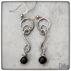 "The jewelry is delivered by Fedex, the delivery time is 3-4 working days! I bent these earrings from stainless steel wire. The wire type is 316L surgical metal wire. I decorated it with an 5-6 mm black onyx gemstone beads. The lever back closure is stainless steel, but not 316L. The high-gloss steel wire I use is a great alternative to silver wire.  It has a deeper gray color than silver.  However, this color is hereditary, does not change.  It does not oxidize, blacken, or discolor.  It gives a very stable jewelry shape.       Parameters: Total height appr.: 5 cm.(2\") I will send the jewel in bubble wrap or in a small box. You can find more earrings from me here: https://www.etsy.com/shop/EWirehu?ref=search_shop_redirect&section_id=28201898 Thank you for your visit!" Unique Black Stainless Steel Jewelry, Hand Forged Black Metal Jewelry, Elegant Handmade Stainless Steel Earrings, Modern Wire Wrapped Drop Earrings, Pierced Dangle Earrings With Wire, Black Stainless Steel Dangle Earrings, Black Stainless Steel Dangle Jewelry, Wire Wrapped Metal Drop Earrings, Unique Nickel-free Wire Earrings