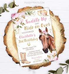 a horse birthday party with pink flowers and gold foil on the head, is shown in front of a wood slice