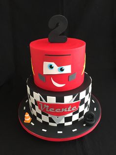 a birthday cake made to look like a race car with the number 2 on top