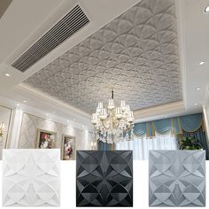 the ceiling in this room is decorated with white and black tiles, chandelier and paintings