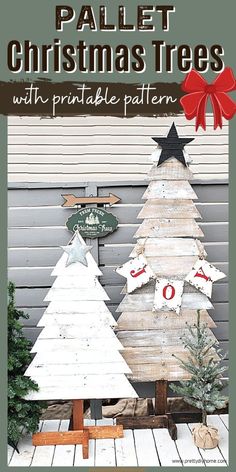 two wooden christmas trees sitting next to each other