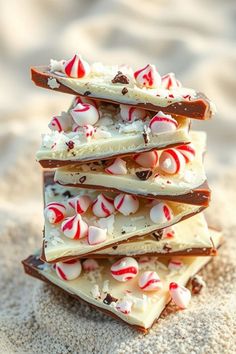 Stack of peppermint bark pieces on sandy surface. White Chocolate Trash, Chocolate Peppermint Bark Recipe, Ghirardelli Peppermint Bark, Homemade Peppermint Bark, Peppermint Dessert, Peppermint Bark Recipes, Chocolate Peppermint Bark, Chocolate Wafer Cookies, Peppermint Candies