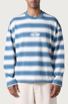 Retro stripes add bold style to a soft, oversized cotton-jersey T-shirt sporting a logo appliqué front and center. 27" length (size Medium) Crewneck Long sleeves 100% cotton Machine wash, tumble dry Imported Black Owned/Founded Oversized Crew T-shirt For Spring, Oversized Blue Tops For College, Sporty Blue Drop Shoulder Tops, Blue Drop Shoulder Sporty Top, Oversized Crew Neck Graphic Tee, Honor The Gift, Retro Stripes, Bold Style, Blue Fits