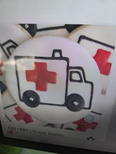 an image of a red and white truck with medical symbols on it