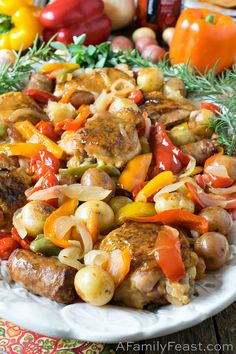 a white plate topped with meat and veggies