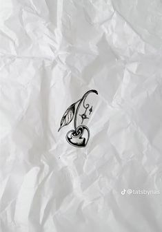 a piece of white paper with a black and white drawing of a bird on it