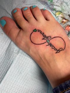 a woman's foot with a tattoo on it