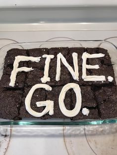 a chocolate cake with white frosting that says fine go on it in the middle