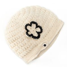 Wood button detail Crocheted pattern Crocheted flower applique Fleece lining FABRIC & CARE Wool/polyester Spot clean Imported One size fits most  Color: White. Gender: female. Age Group: adult. Pattern: Solid. Knitted Wool Beanie, Fur Pom Pom Beanie, Warm Hats, Crocheted Flower, Crochet Cable, Slouchy Style, Striped Beanies, Crochet Wool, Flower Crochet