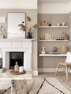 a living room filled with furniture and a fire place in the middle of a room