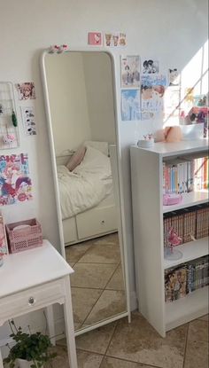 a room with a mirror, bookshelf and other items