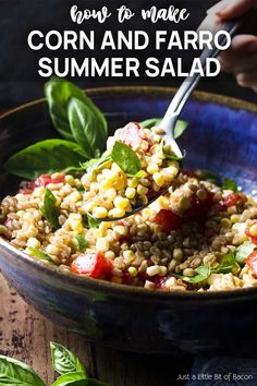 corn and faro salad in a blue bowl with spinach leaves on the side