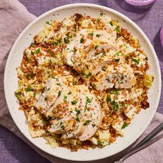 a white plate topped with chicken covered in gravy