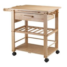 a wooden kitchen cart with drawers on wheels