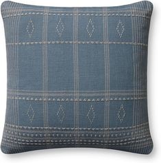 a blue pillow with white stitching on the front and back, in an argyle pattern