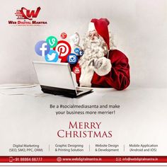 a man dressed as santa claus sitting in front of a laptop computer with social media icons on the screen