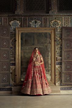 Red raw silk lehenga choli with tissue applique and doriwork , highlighted with dabka beads,...