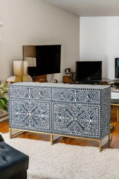 a living room filled with furniture and a flat screen tv