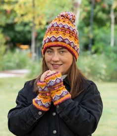 A striking fair isle pattern with bright , eye-cathing diamond shapes in pumpkin color background.  Wrap up warm in our fleece lined bobble beanie, warm fingerless gloves and knitted headband. Perfect gift for halloween ! ✔️QUALİTY: * Material: Wool & Polyester Fleece Lining Fleece lining applies to the headband, handwarmers and around the forehead for the beanie. * Quality and Sustainability: Handmade ∙ Slow Fashion * All our knitwear is handmade with love ! ✔️SIZE : Available for S/M/L/XL size Fitted Multicolor Winter Hats, Winter Beanie Patterns, One Size Fits Most, One Size Fits Most Winter Beanie Pattern, Multicolor Fair Isle Pattern For Winter, Nordic Winter Multicolor Patterns, Multicolor Nordic Winter Patterns, Nordic Multicolor Winter Patterns, Knitted Headband, Winter Headbands