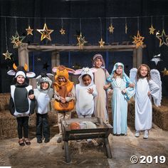 a group of children dressed up in nativity costumes