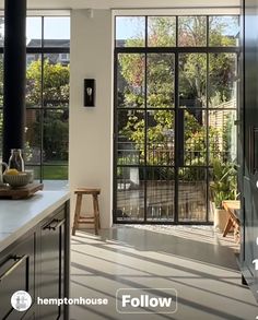 an open kitchen with sliding glass doors leading to the outside