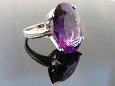 8.82 ct Zambian Amethyst Ring Luxury White Gold Amethyst Ring With Diamond Accents, Luxury Amethyst Ring With Diamond Accents For Promise, Luxury Amethyst Promise Ring With Diamond Accents, Luxury Amethyst Ring With Diamond Accents For Anniversary, Luxury Polished Amethyst Ring For Wedding, Oval Purple Platinum Rings, Luxury Amethyst Ring For Wedding With Polished Finish, Luxury Sterling Silver Amethyst Ring For Formal Events, Luxury Sterling Silver Amethyst Ring For Formal Occasions