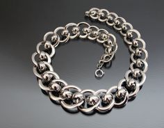 "Iconic Bauhaus style necklace. 1930's, Idar-Oberstein, Germany, Jakob Bengel. (Identify: Das Industriedenkmal Jakob Bengel, Idar-Oberstein). MADE OF: metal chrome plated, brass possibly. CONDITION: Excellent vintage condition - no loses of plate, dents or repairs. Spring ring clasp works fine. MEASUREMENTS: Length from end to end: 15 3/4\" (39,7cm). Width: 5/8\" - 1\" (15 - 24mm). Weight: 72,4g * * * All our items are packed in gift boxes, easy to check of content and re-pack. If you wish somet Chain Art, Christmas Bling, Bauhaus Style, Style Necklace, Chrome Plating, Gift Boxes, Spring Rings, Chains Necklace, Fashion Rings