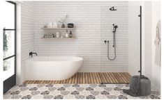 a bathroom with a white brick wall and wooden flooring that matches the bathtub