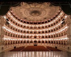 the interior of an auditorium with rows of seats